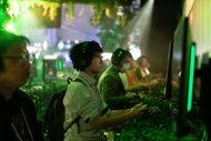 Attendees playing Metal Gear Solid at Tokyo Game Show (Image via Getty)